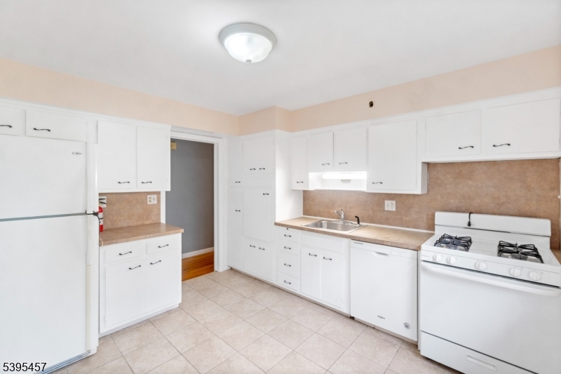 726 Gates Terrace Union, NJ 07083 - Photo 5 of 16 a kitchen with cabinets appliances and a sink