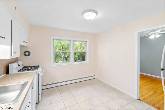 a view of storage and utility room with a window
