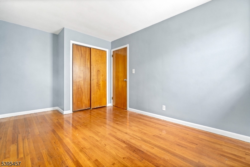 726 Gates Terrace Union, NJ 07083 - Photo 7 of 16 a view of an empty room with wooden floor