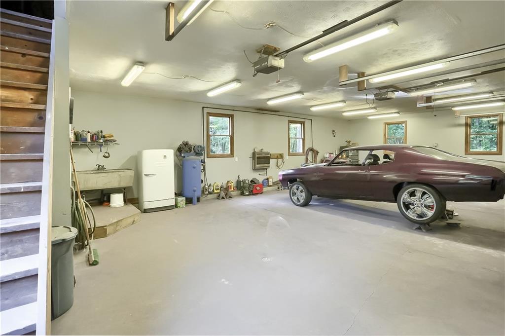 115 McLafferty Road Fenelton, PA 16034 - Photo 22 of 25 Interior of the attached 3 car garage measures approximately 25*40-note the steps on the left which access the huge storage room above the garage.
