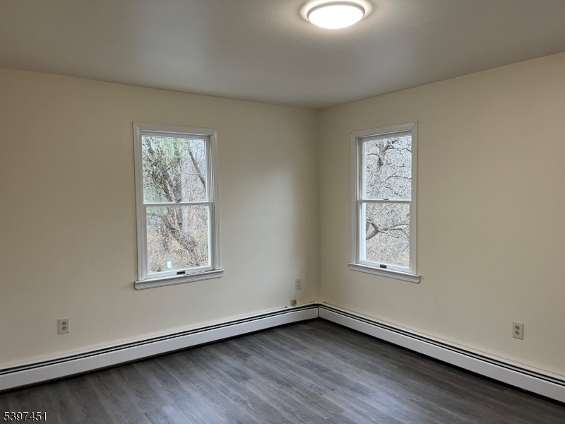 184 Main Street Andover, NJ 07821 - Photo 5 of 11 an empty room with windows