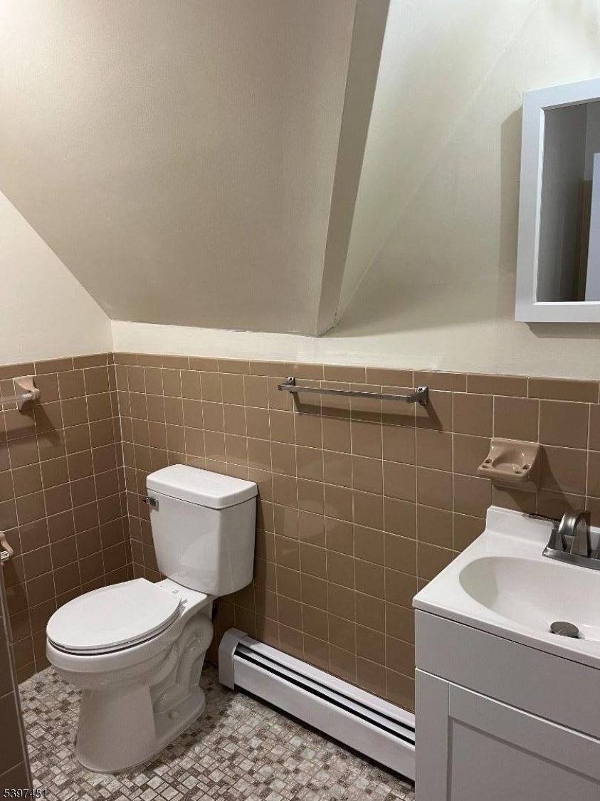 184 Main Street Andover, NJ 07821 - Photo 9 of 11 a bathroom with a sink and a toilet