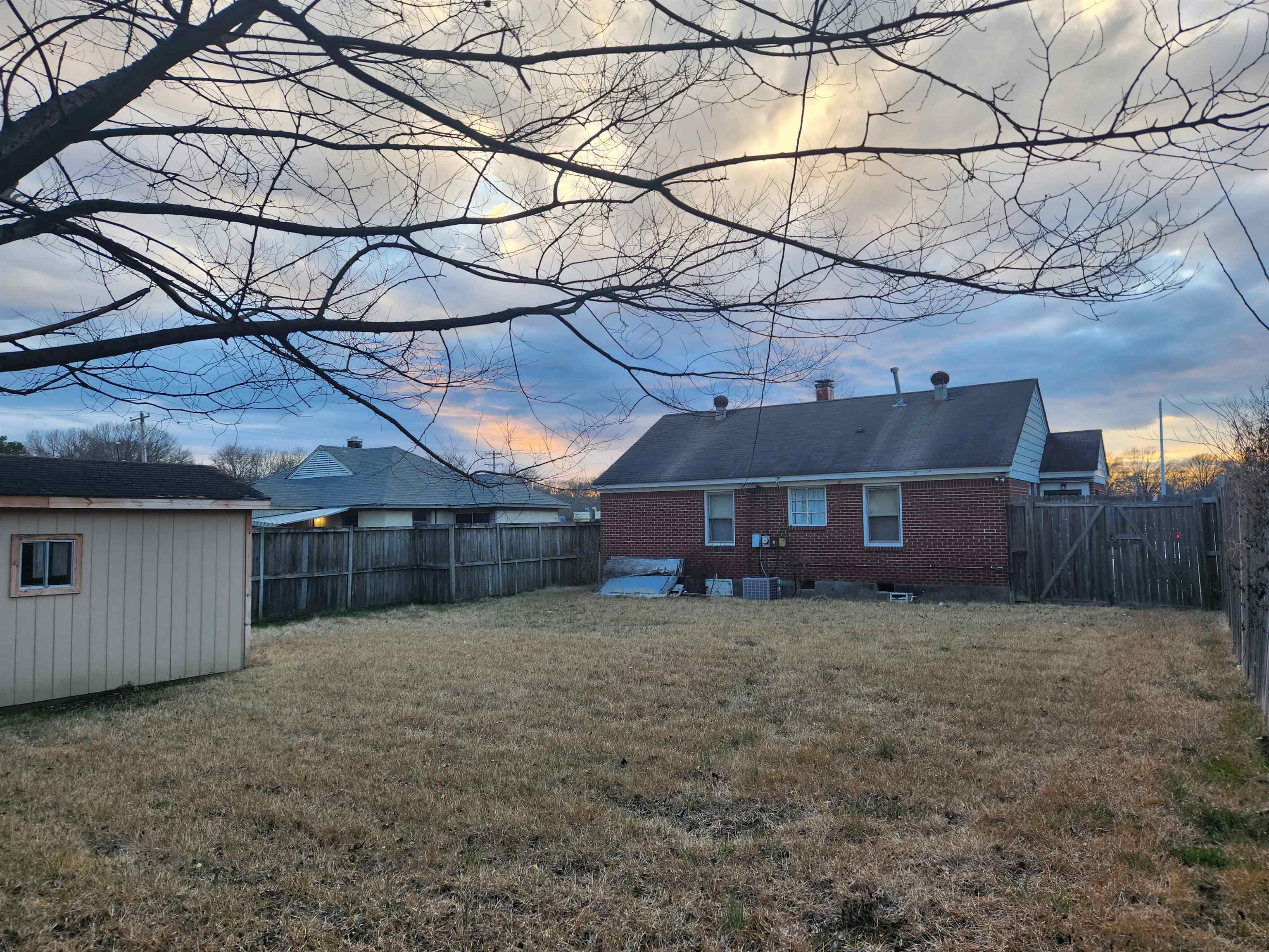 1452 South Perkins Road Memphis, TN 38117 - Photo 19 of 22 a view of a house with a yard and a garage