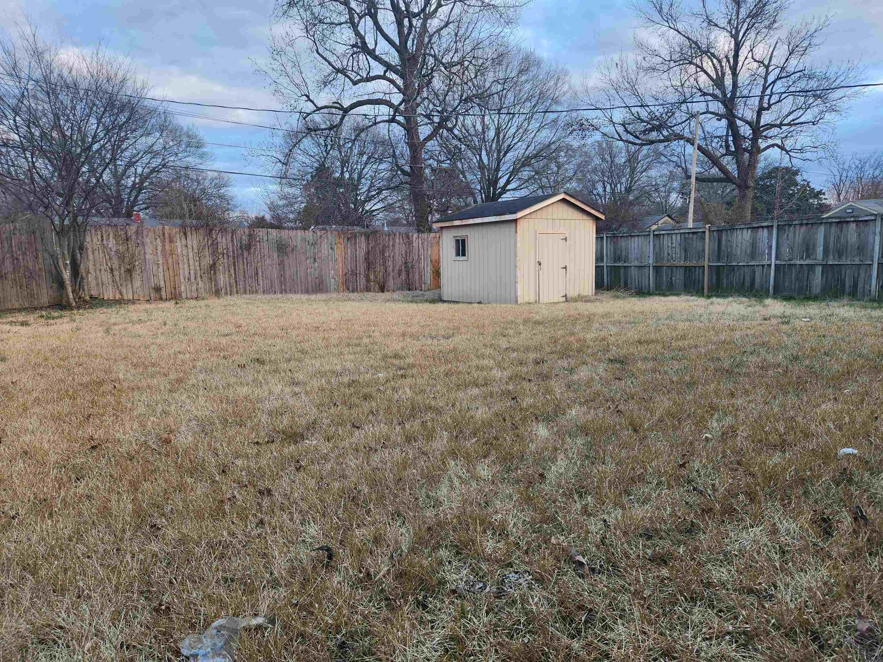 1452 South Perkins Road Memphis, TN 38117 - Photo 20 of 22 a house with trees in front of it
