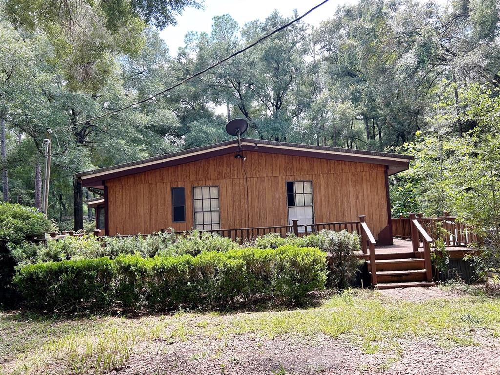 16242 Southwest 55 Street Ocala, FL 34481 - Photo 1 of 1 You Could make this your Cabin in the Woods