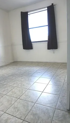 an empty room with window