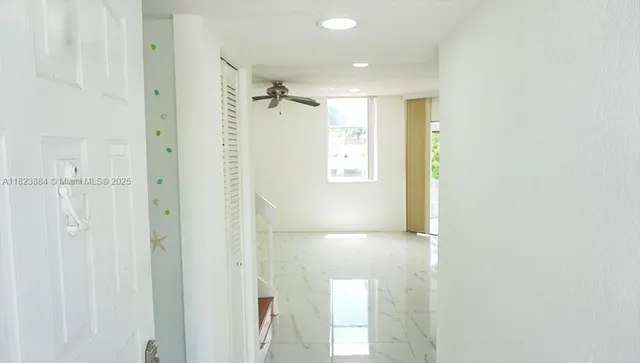 a bathroom with a shower and a glass door