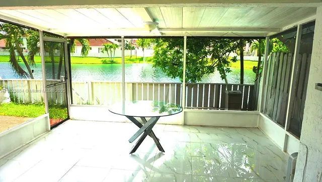 a view of an outdoor space with a large window