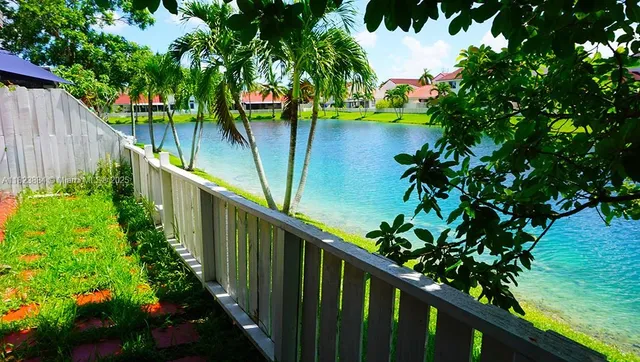 a view of a house with a flower garden