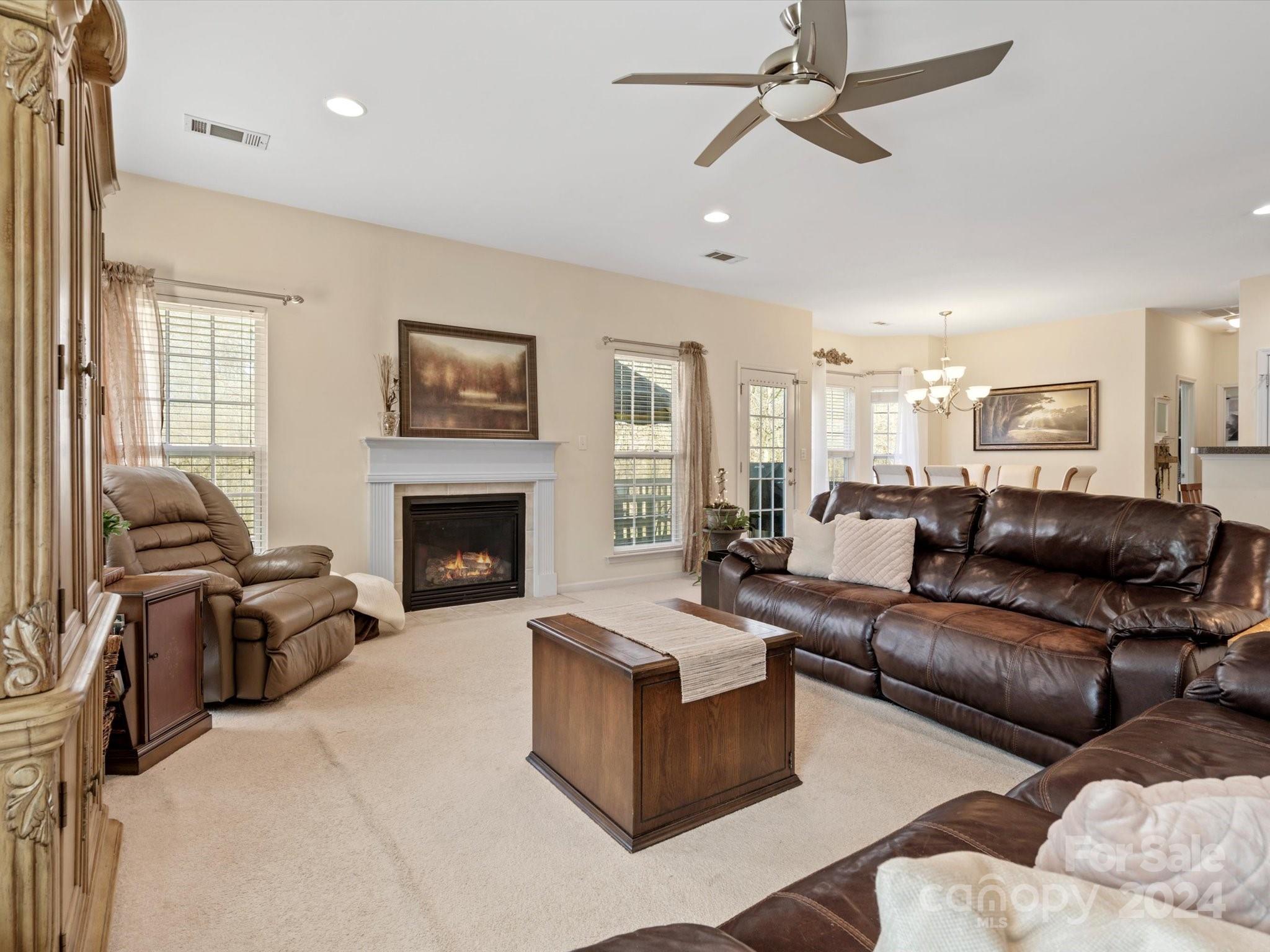 219 Clear Spring Court Fort Mill, SC 29708 - Photo 15 of 38 a living room with furniture fireplace and a window