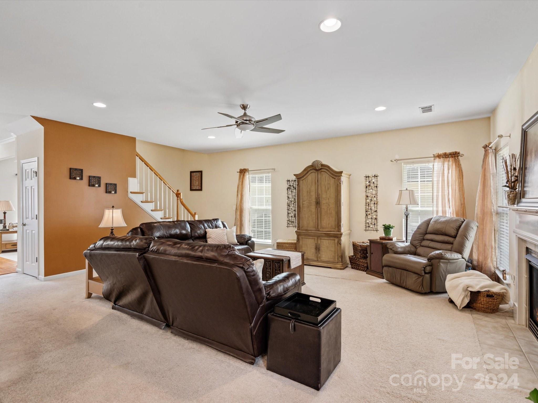 219 Clear Spring Court Fort Mill, SC 29708 - Photo 16 of 38 a living room with furniture a air conditioner vent and a large window