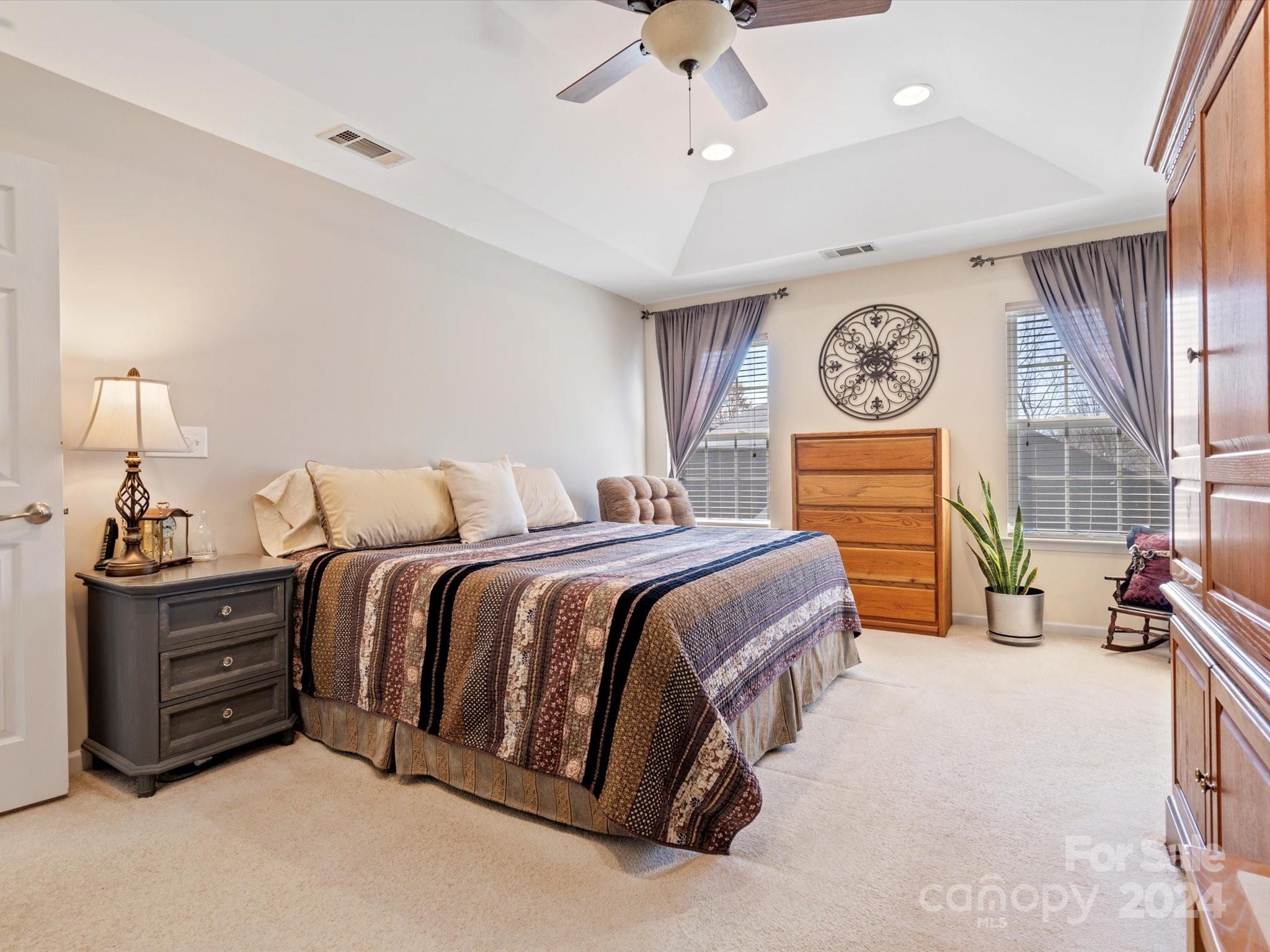 219 Clear Spring Court Fort Mill, SC 29708 - Photo 20 of 38 a bedroom with a bed and ceiling fan