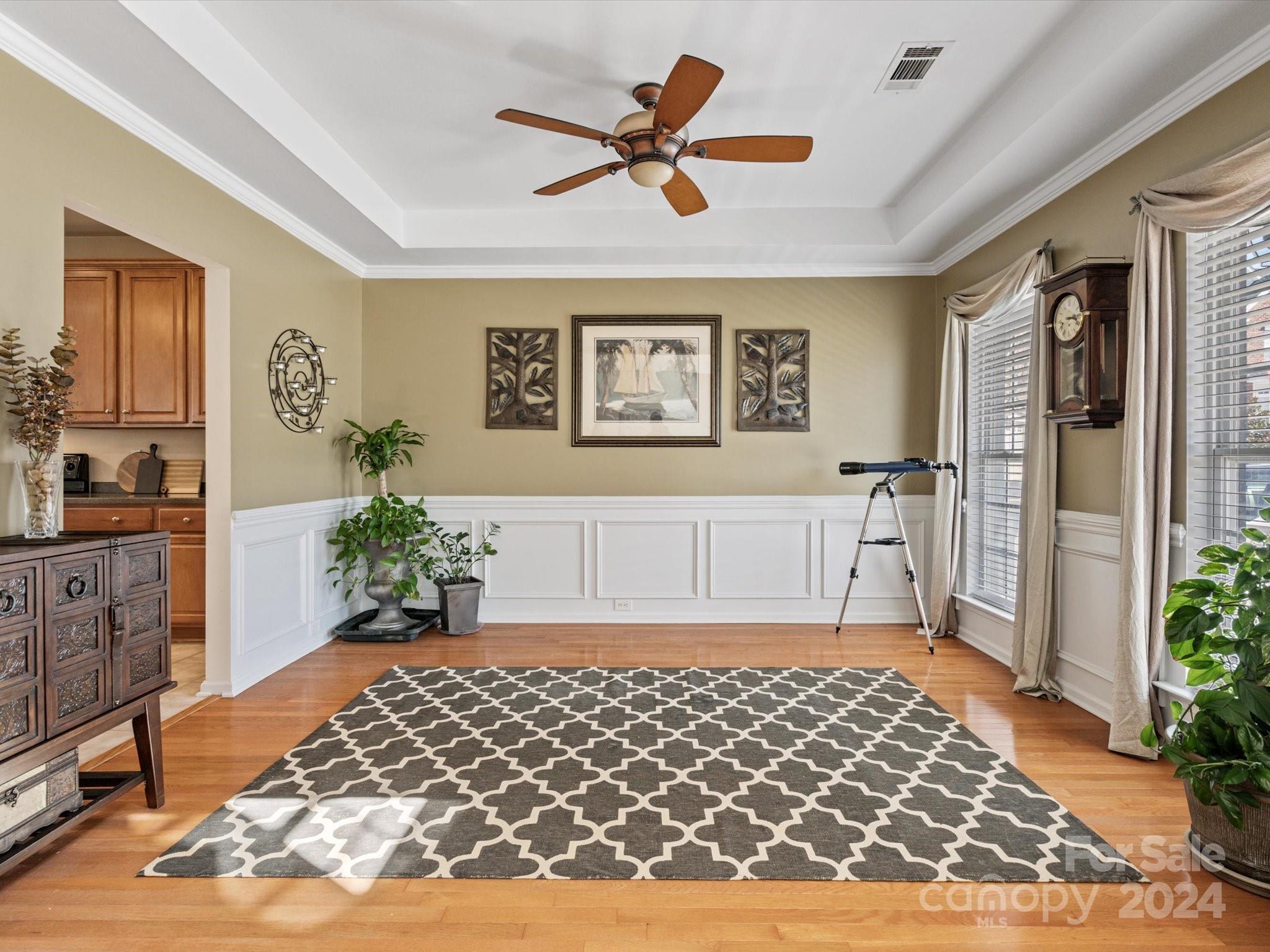 219 Clear Spring Court Fort Mill, SC 29708 - Photo 6 of 38 a living room with a couch and a potted plant