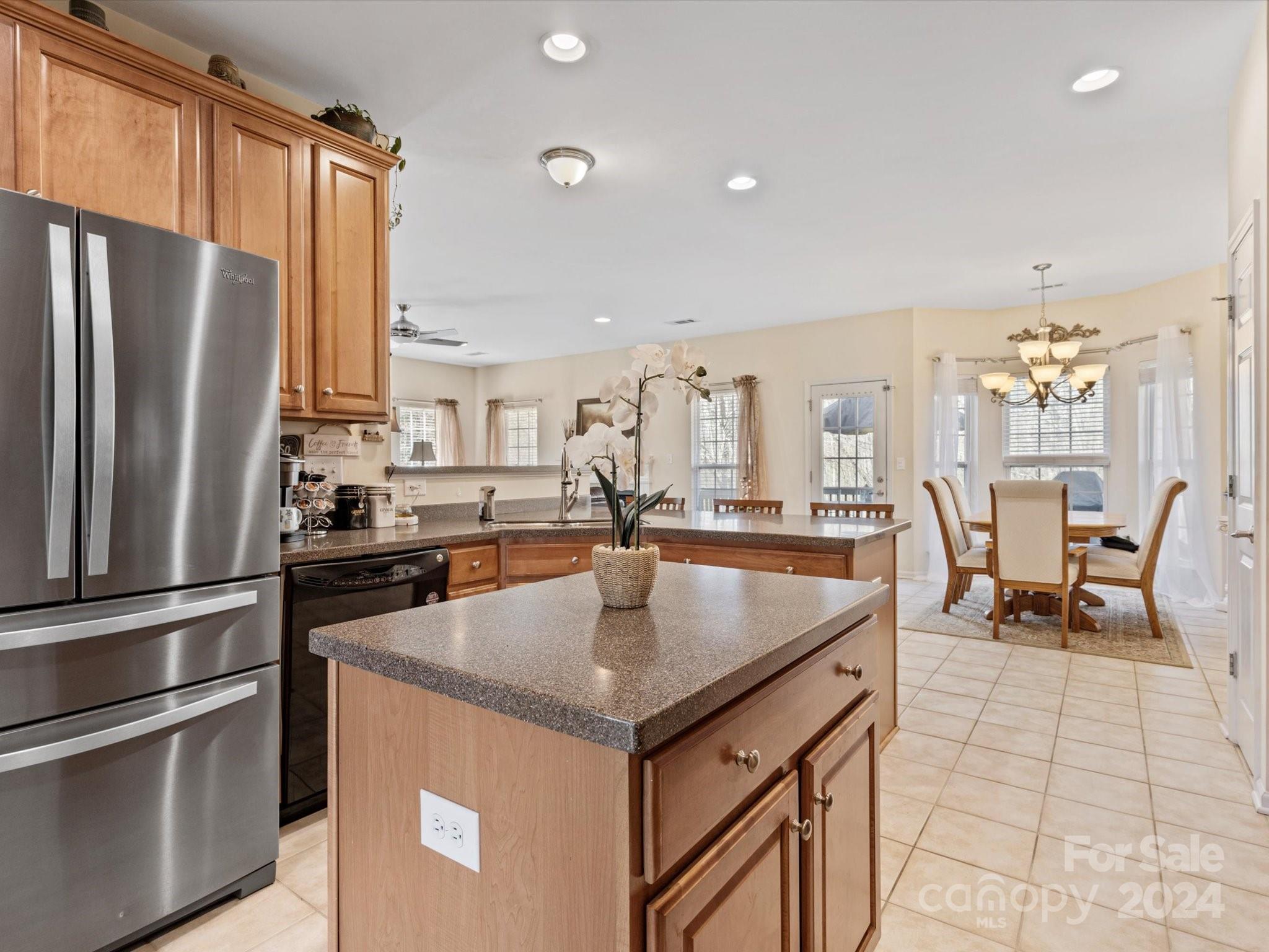 219 Clear Spring Court Fort Mill, SC 29708 - Photo 7 of 38 a kitchen with stainless steel appliances granite countertop a sink a stove and a refrigerator