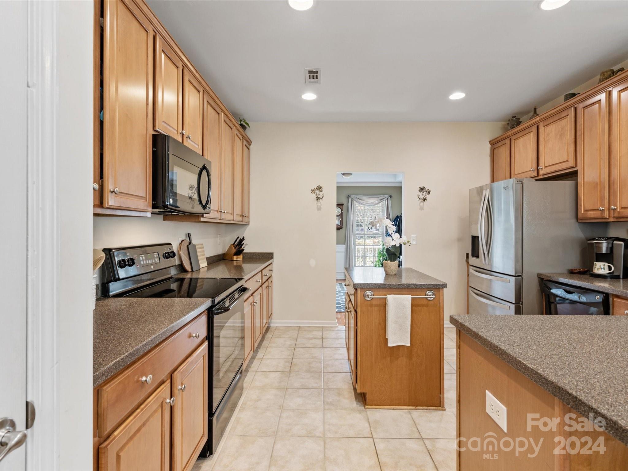 219 Clear Spring Court Fort Mill, SC 29708 - Photo 8 of 38 a kitchen with stainless steel appliances granite countertop a refrigerator a stove and a sink