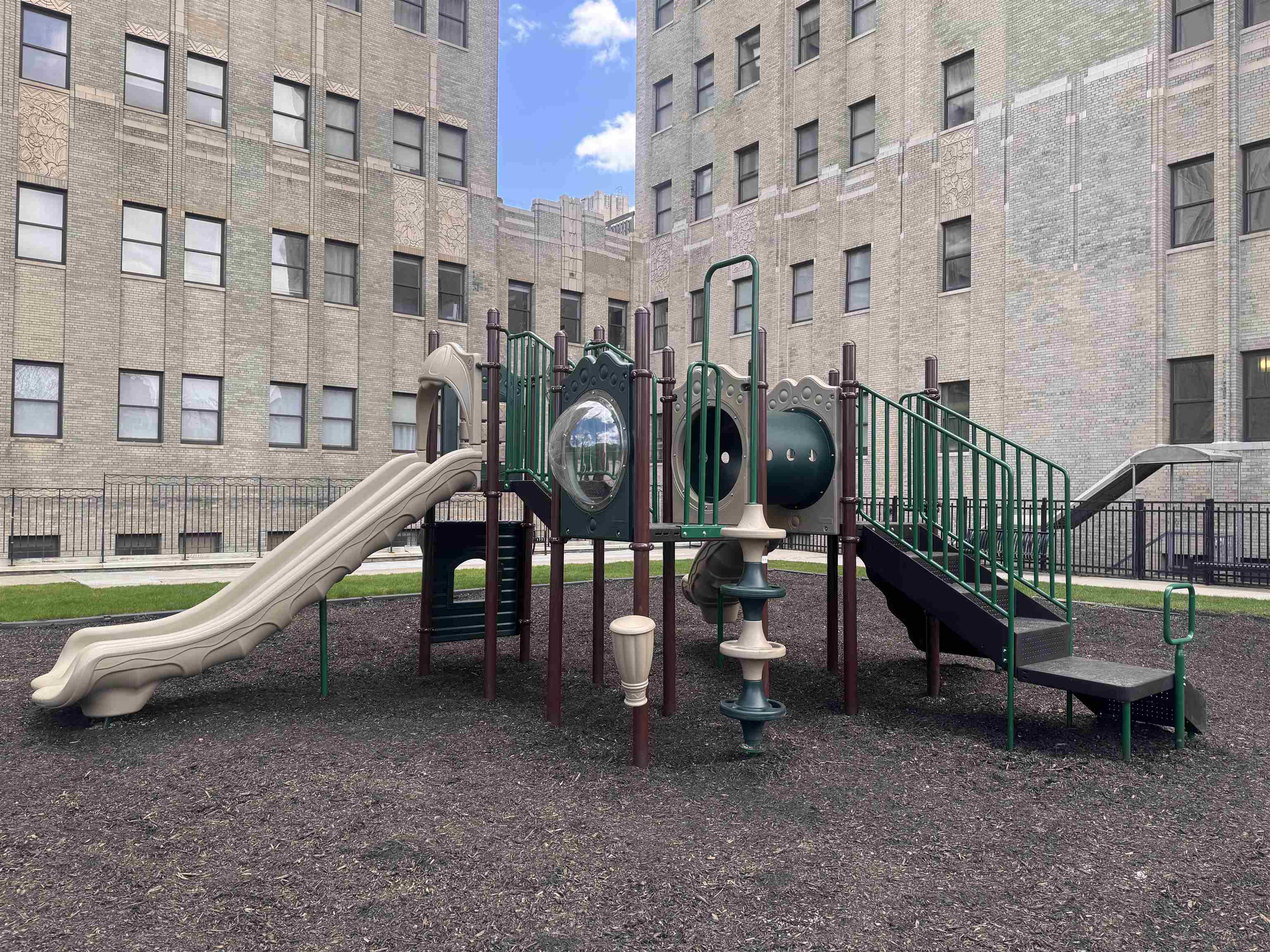 20 Beacon Way, Unit T1106 Jersey City, NJ 07304 - Photo 20 of 21 a childrens park with lots of swings and slides