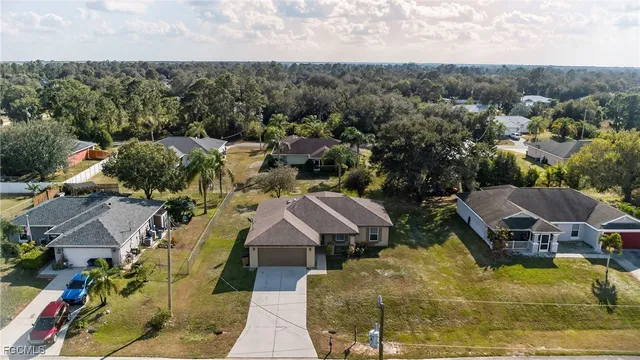 an aerial view of a houses with a garden