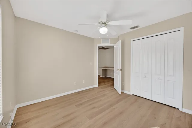 a view of a livingroom with a chandelier fan