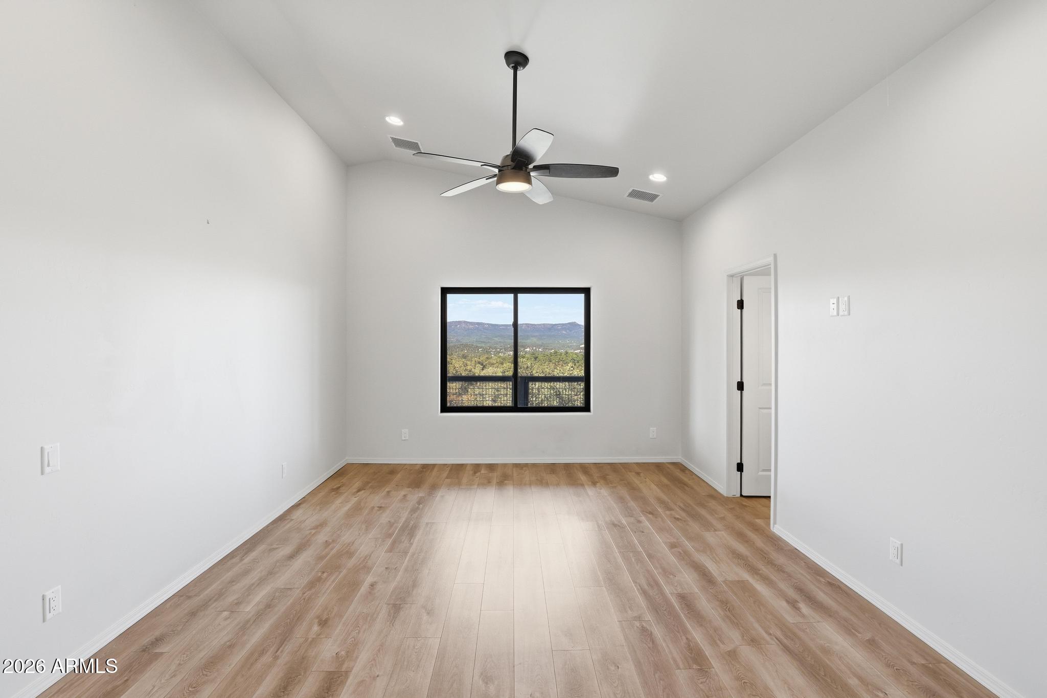 1908 East Starlight Pass Payson, AZ 85541 - Photo 23 of 30 wooden floor in an empty room with a window