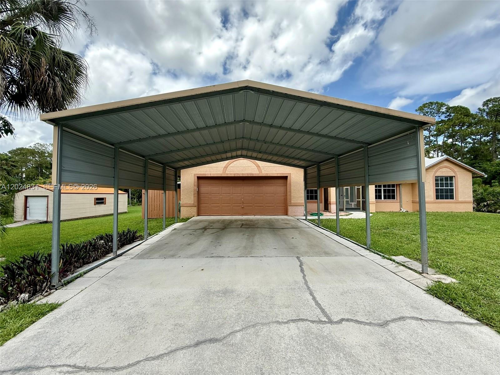 15819 76th Road North Loxahatchee, FL 33470 - Photo 6 of 45 a view of backyard of house and green space