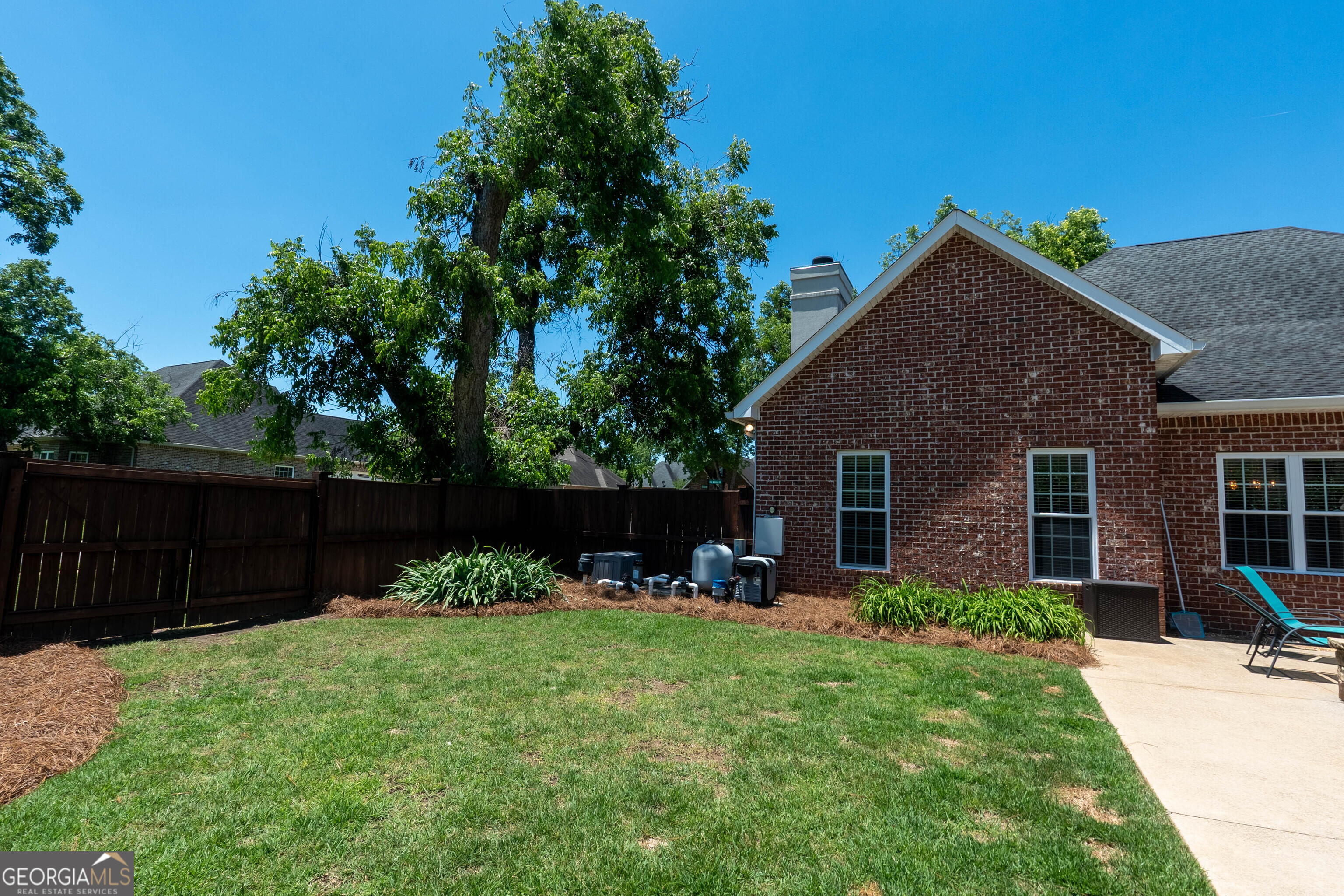 501 Old Bridge Road Warner Robins, GA 31088 - Photo 53 of 54 a backyard of a house with table and chairs