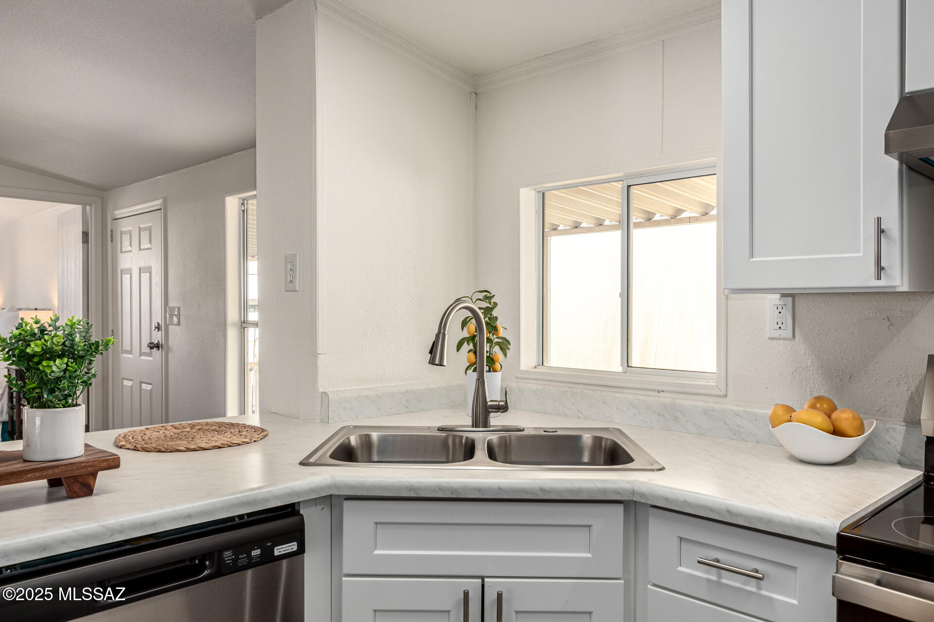 8401 South Kolb Road, Unit 94 Tucson, AZ 85756 - Photo 13 of 24 a kitchen with stainless steel appliances sink and window