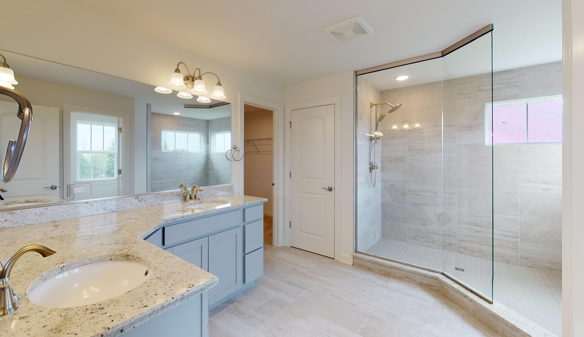 4335 Little Leaf Road Naperville, IL 60564 - Photo 13 of 13 a spacious bathroom with a granite countertop sink a mirror and shower