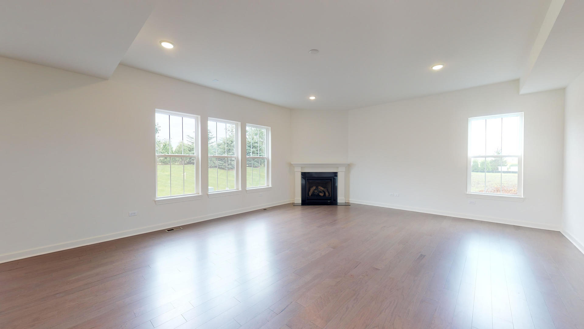 4335 Little Leaf Road Naperville, IL 60564 - Photo 3 of 13 an empty room with wooden floor and windows