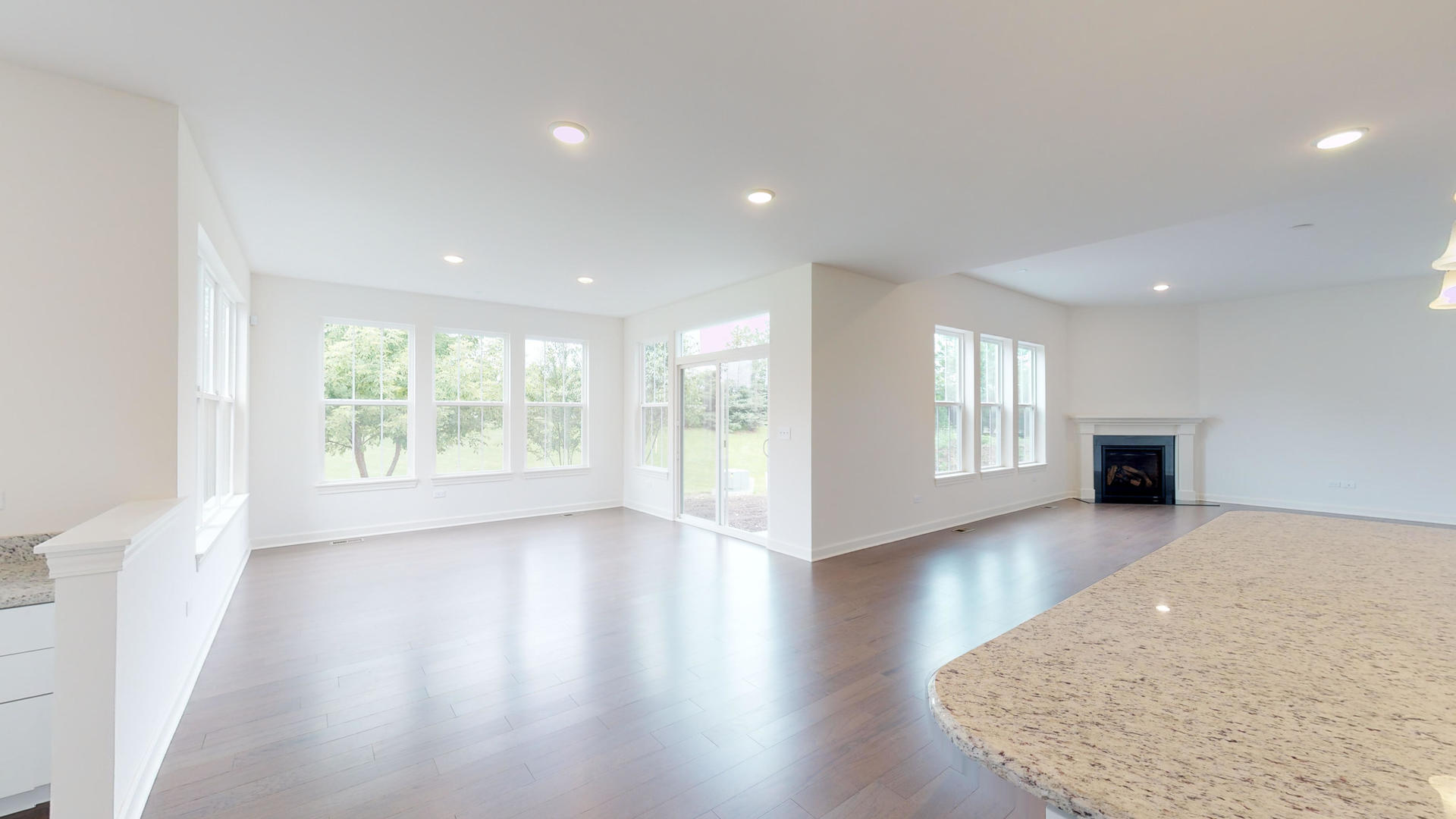 4335 Little Leaf Road Naperville, IL 60564 - Photo 4 of 13 a view of an empty room with wooden floor and a window