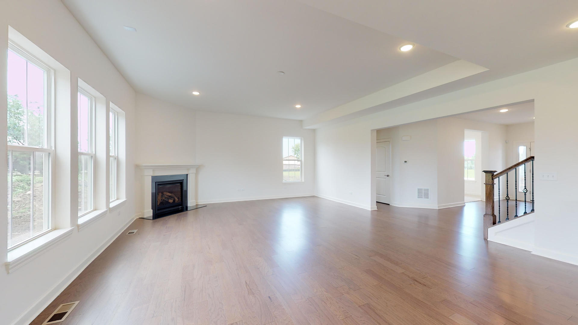 4335 Little Leaf Road Naperville, IL 60564 - Photo 5 of 13 a view of an empty room with a window and wooden floor