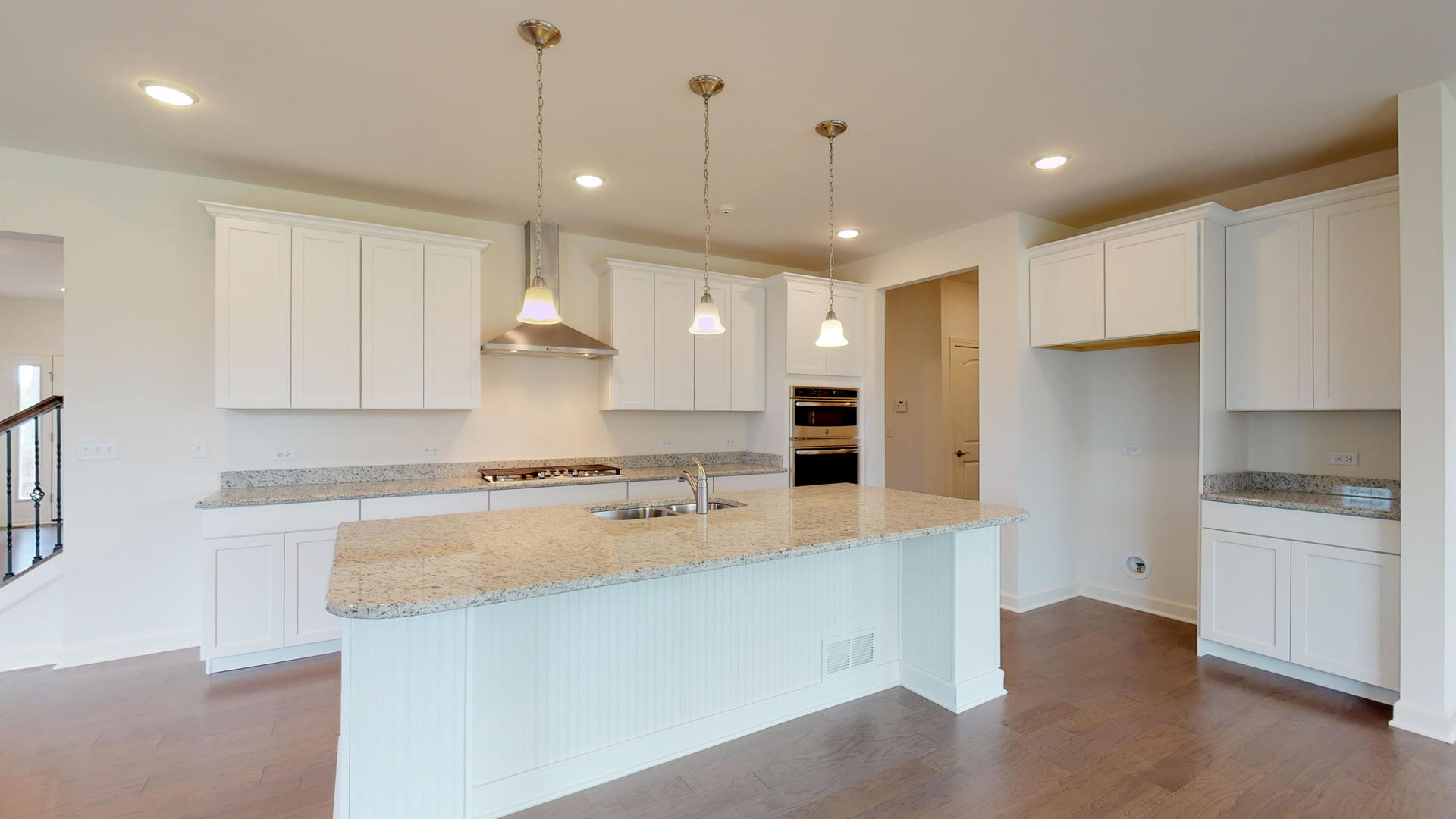 4335 Little Leaf Road Naperville, IL 60564 - Photo 7 of 13 a large kitchen with stainless steel appliances granite countertop a sink a stove and a refrigerator
