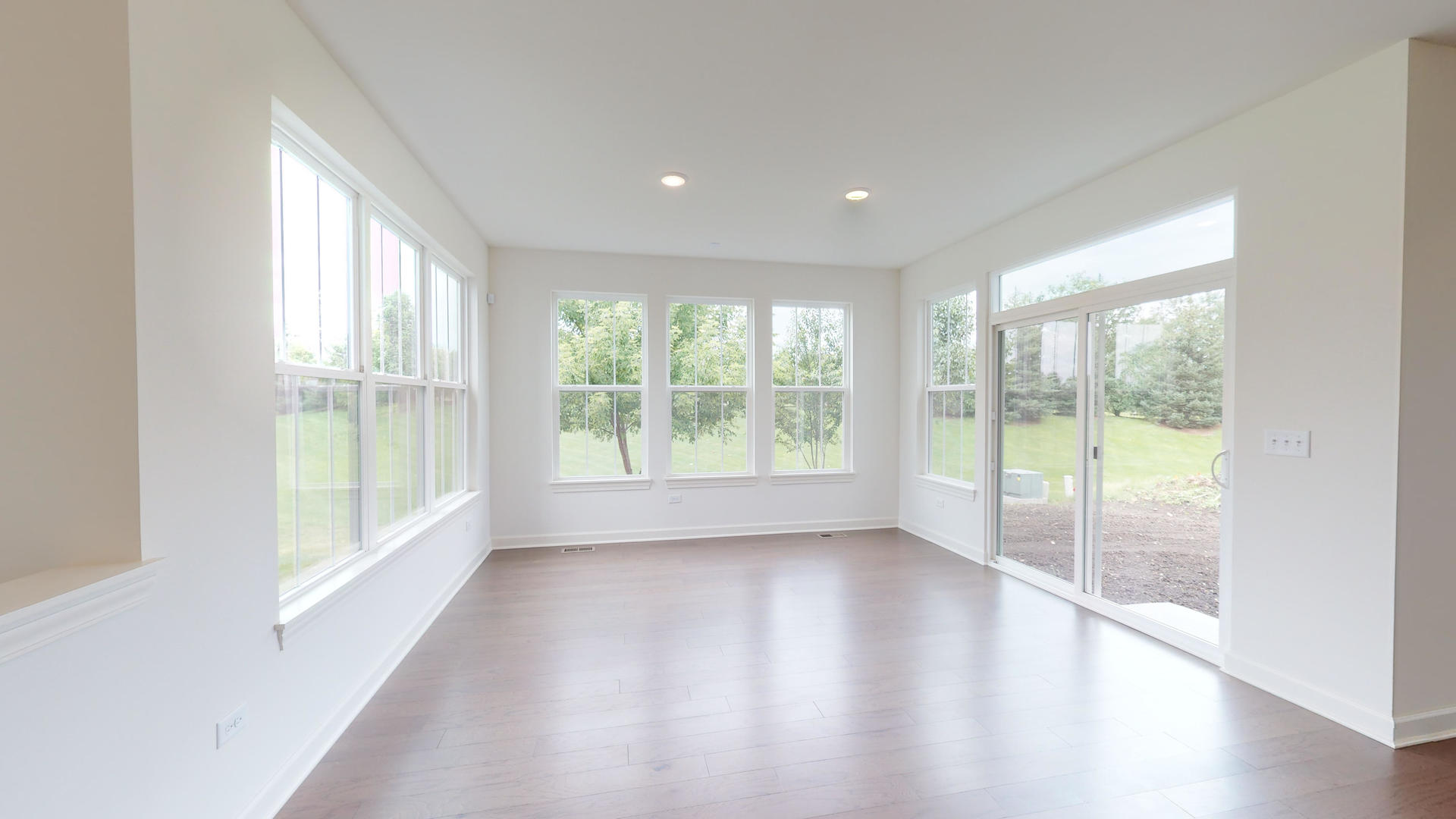 4335 Little Leaf Road Naperville, IL 60564 - Photo 9 of 13 a view of an empty room with wooden floor and a window
