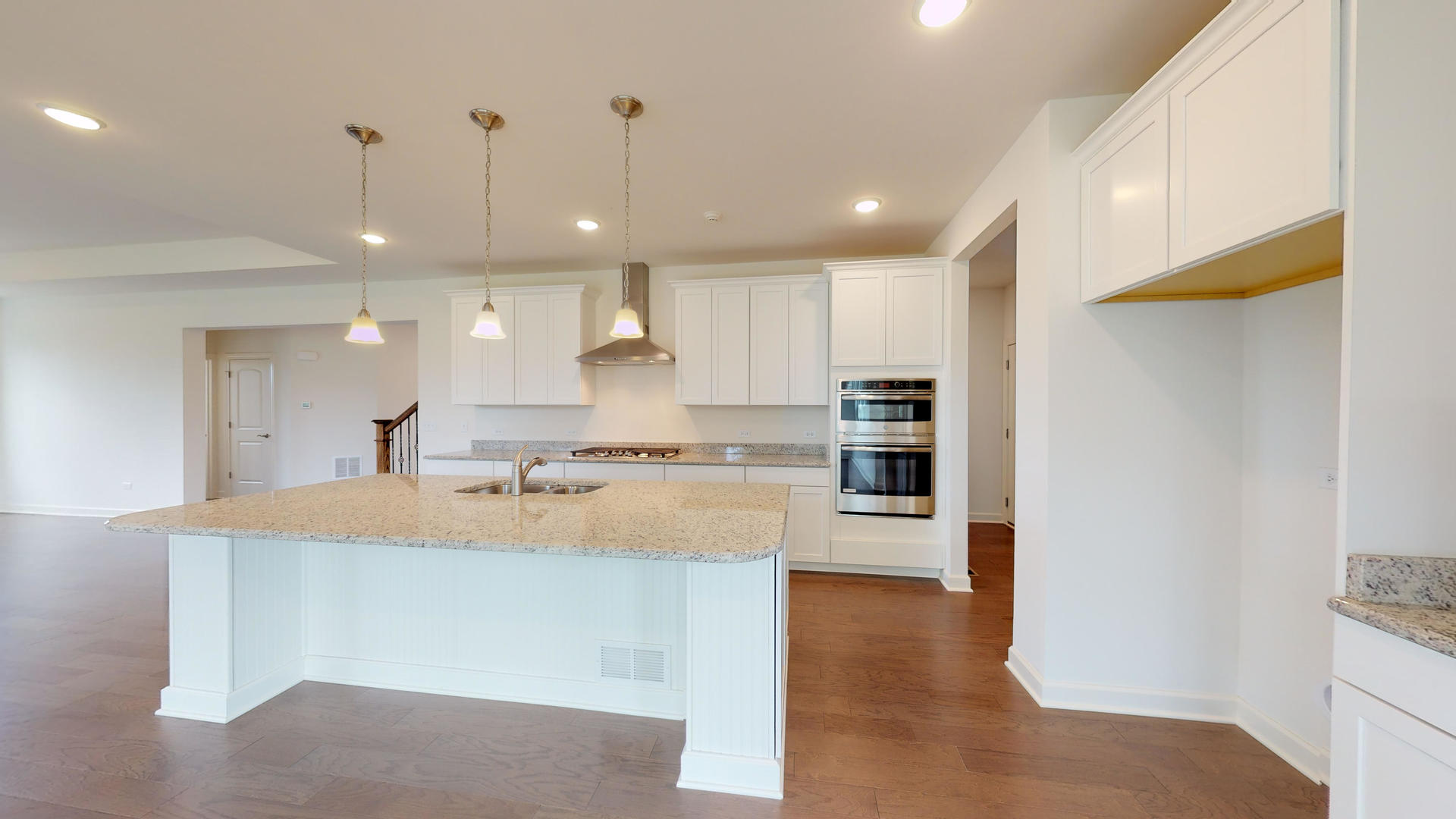 4335 Little Leaf Road Naperville, IL 60564 - Photo 10 of 13 a large kitchen with kitchen island a sink stainless steel appliances and cabinets