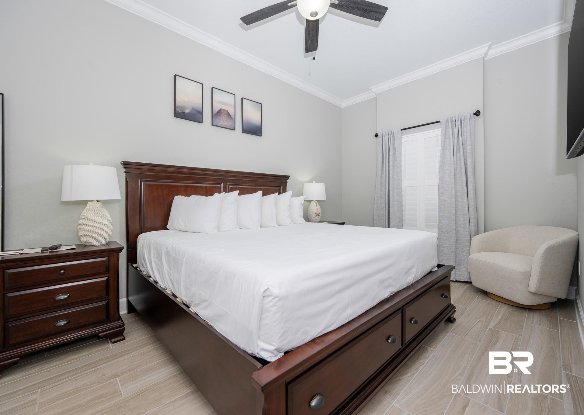 23008 Perdido Beach Boulevard, Unit 506 Orange Beach, AL 36561 - Photo 12 of 48 Bedroom featuring ornamental molding, light wood finished floors, and a ceiling fan