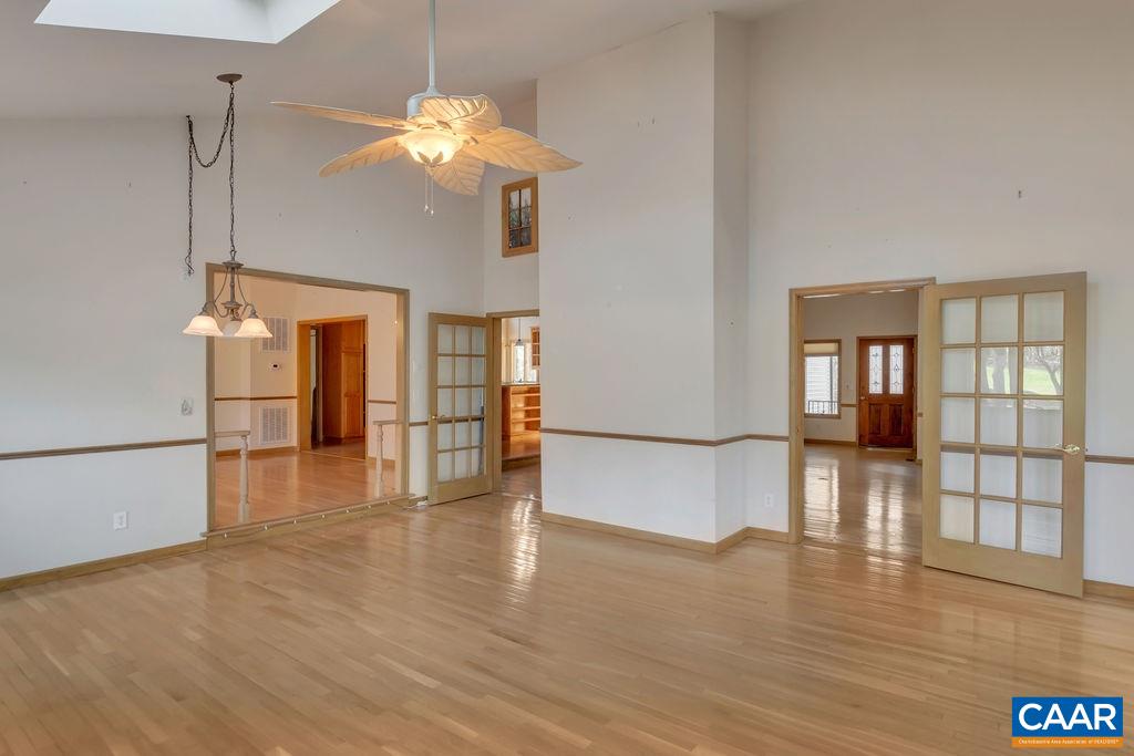 9 Out Of Bounds Road Palmyra, VA 22963 - Photo 15 of 37 a view of an empty room with wooden floor and a window