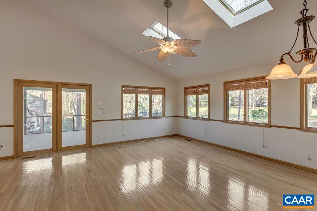 9 Out Of Bounds Road Palmyra, VA 22963 - Photo 16 of 37 a view of an empty room with wooden floor and a window