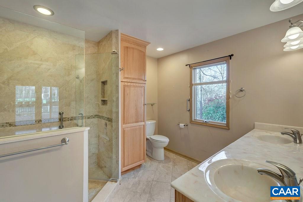 9 Out Of Bounds Road Palmyra, VA 22963 - Photo 20 of 37 a bathroom with a sink a toilet and shower