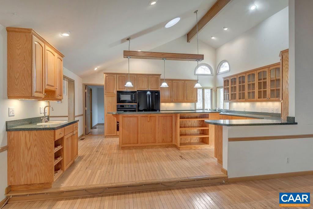9 Out Of Bounds Road Palmyra, VA 22963 - Photo 7 of 37 a large kitchen with cabinets and a counter top space