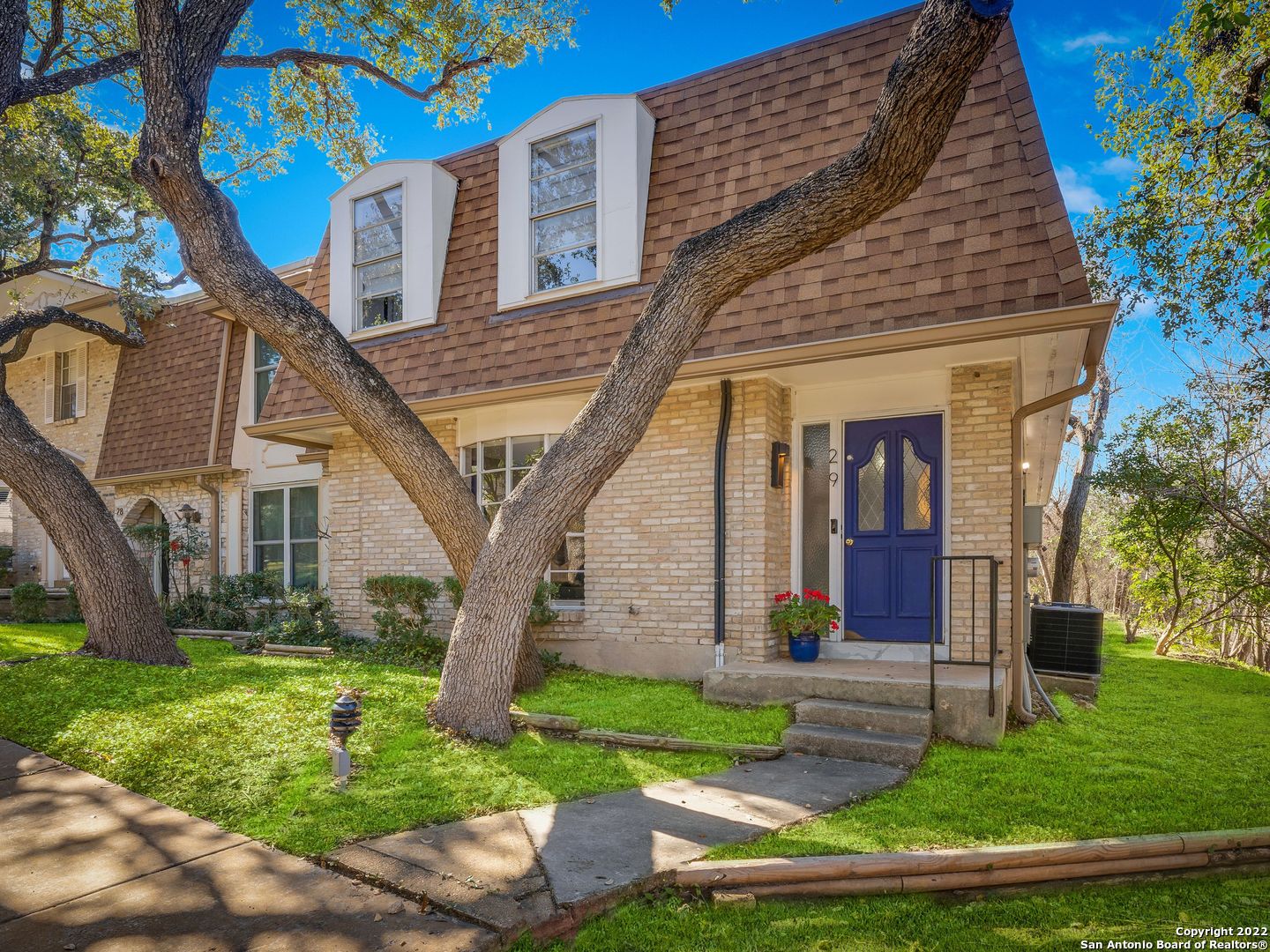 front view of a house with a yard