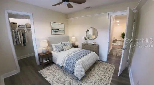 a bed room with a bed and a mirror