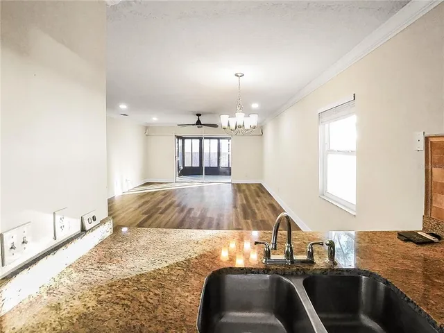 a kitchen with a sink and a window
