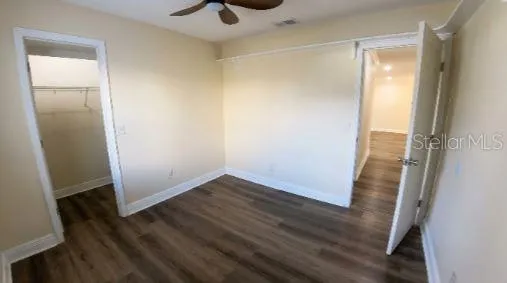 an empty room with wooden floor