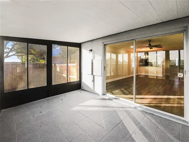 a view of an empty room and window