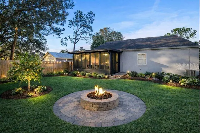 a view of a backyard with plants and a garden