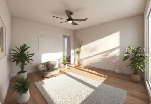 a living room with furniture and potted plant