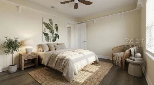 a bedroom with a bed and a couch