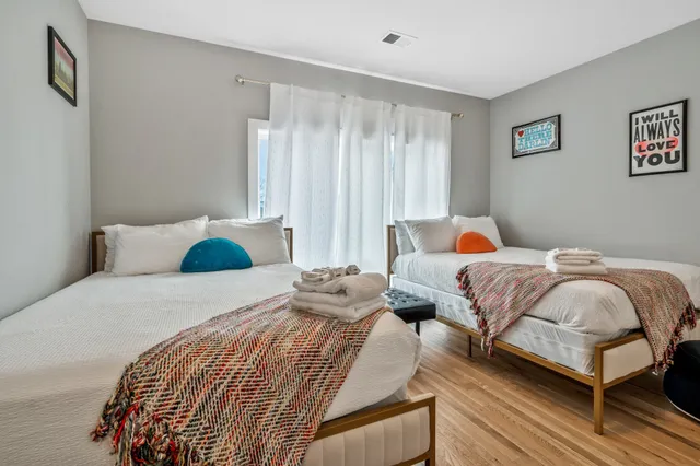 a bedroom with a bed and window