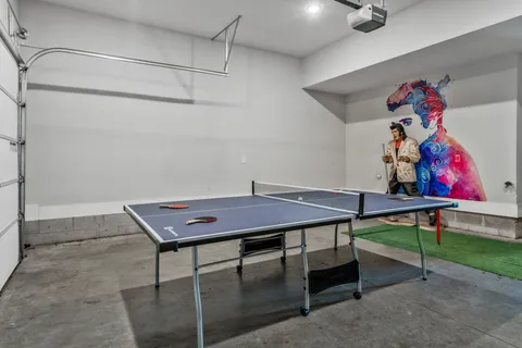 a room with furniture and air hockey table