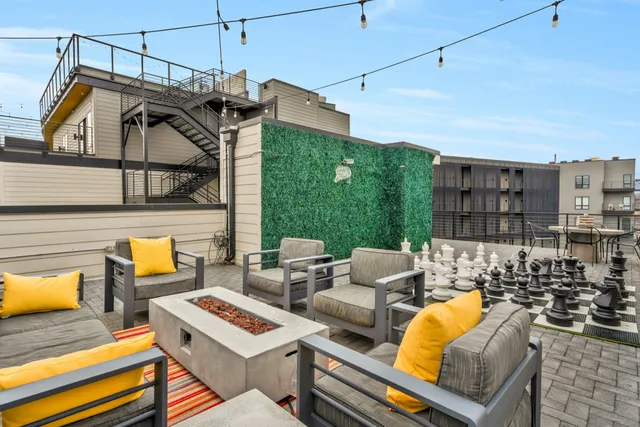 a view of a patio with couches and a table