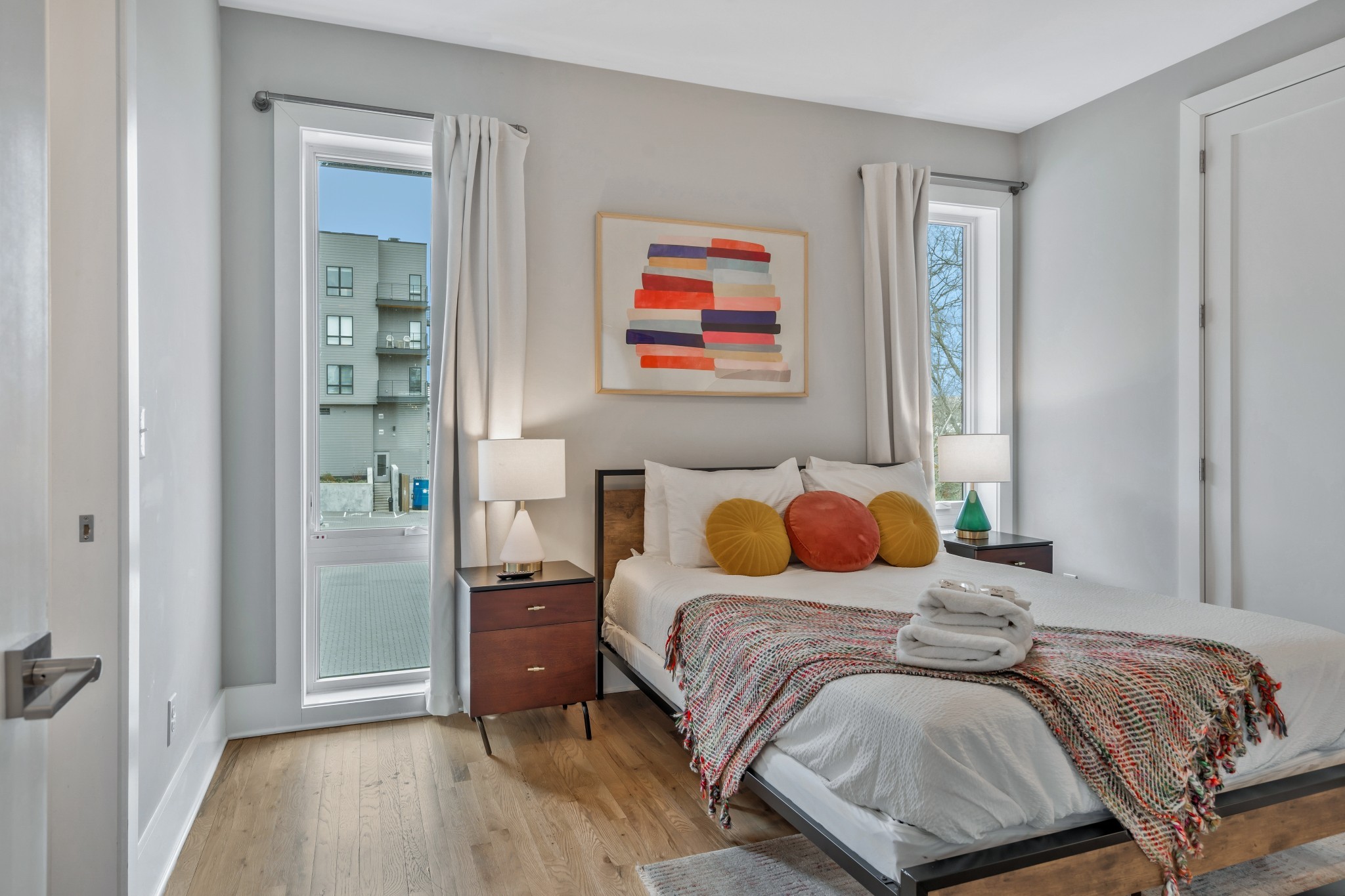 705 27th Avenue North Nashville, TN 37209 - Photo 9 of 41 a bedroom with a bed and wooden floor